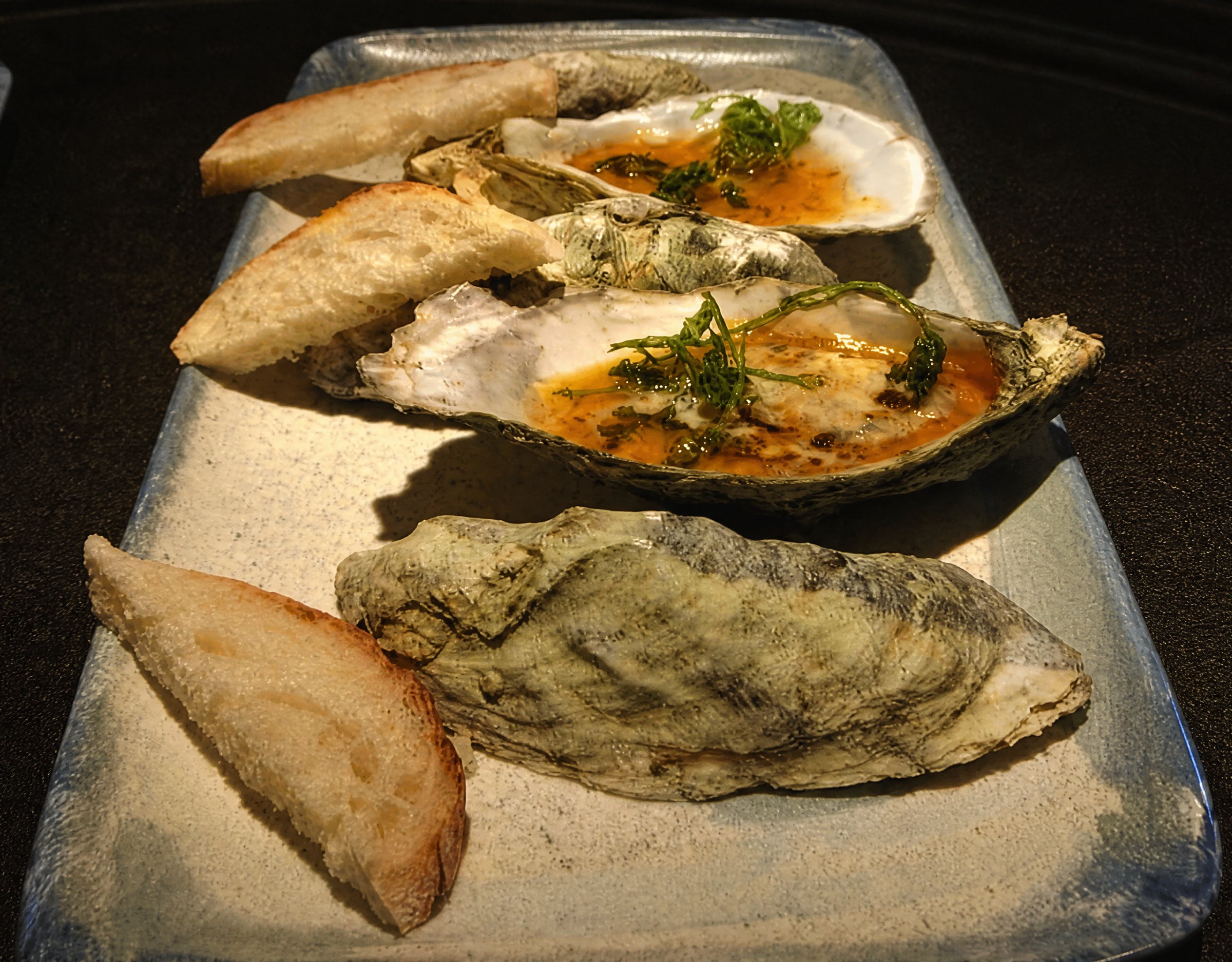 Baked oysters with toasted bread at Casamarte, La Paz